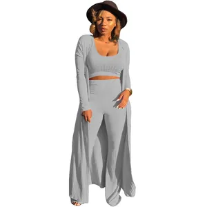 Three-piece gray ribbed knit set featuring crop top, long pants and matching cardigan