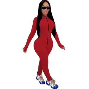 Detail view of red tight-fitting jumpsuit featuring front zipper and long sleeves design