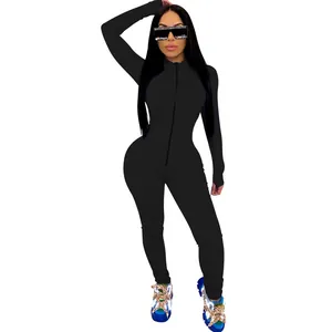Full-body view of a sexy black tight-fitting jumpsuit with front zipper detail