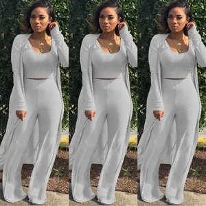 Detailed look at a 3-piece grey ribbed set including a crop top, pants and cardigan