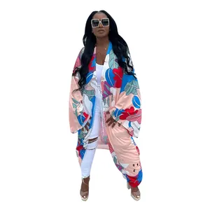 Detailed view of women's loose printed kimono cardigan with vibrant floral patterns