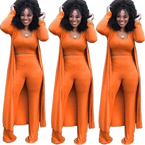 Vibrant orange ribbed three-piece outfit featuring a long cardigan and wide-leg pants
