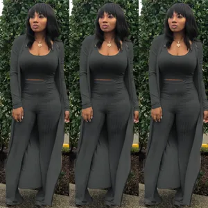 Detail view of a dark grey ribbed high-stretch three-piece set including a long cardigan