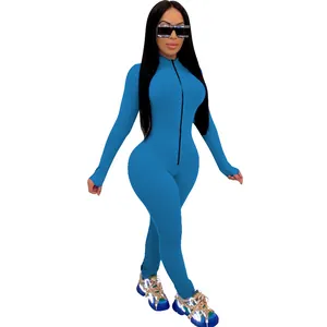 Full body view of a tight-fitting blue long-sleeved jumpsuit with a front zipper detail