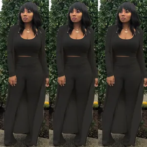 Detail of sexy 3-piece black ribbed set with crop top, pants, and long cardigan