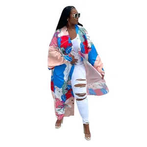 Detailed full-length shot of a vibrant floral printed kimono windbreaker for women.