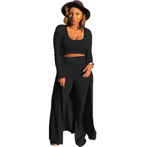 Detailed view of women's black ribbed three-piece set with long cardigan and crop top.