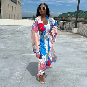 Full view of women's autumn casual kimono coat with vibrant tropical leaf print.