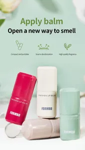 Detailed view of FORMBO solid perfume balms in various pastel colors and sleek tubes