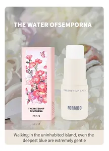 Detailed view of FORMBO long-lasting solid fragrance balm with elegant floral packaging