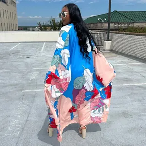 Detailed rear view of a vibrant floral print oversized long sleeve open front kimono duster