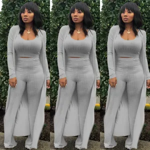 Elegant three-piece grey ribbed high-stretch outfit featuring crop top, pants and cardigan