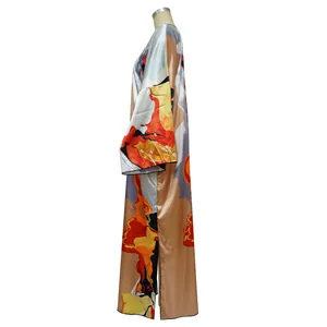 Side view of long loose kimono-style cardigan with vibrant abstract prints on bronze satin