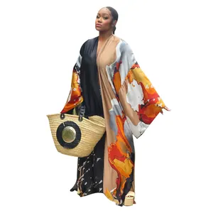 Detail of a loose casual kimono long sleeve duster with vibrant autumn floral print design