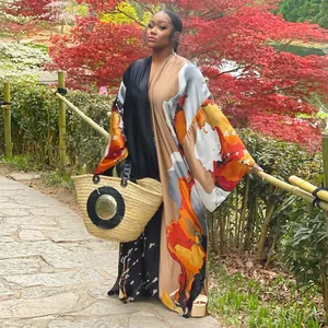 Women's loose casual kimono cardigan featuring abstract multi-color floral print detail