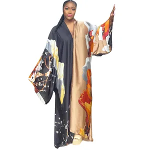 Full view of loose printed kimono coat with artistic floral patterns and gold finish