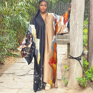 Women's loose casual kimono robe with vibrant prints shown in a natural outdoor setting