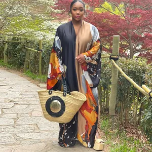 Elegant loose printed kimono maxi dress featuring autumn floral patterns in a garden
