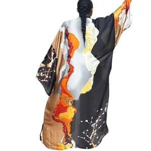 Back view of a loose-fit long sleeve kimono cardigan with vibrant landscape prints