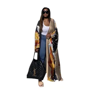 Full body detail of a stylish women's floral print long kimono duster cardigan.
