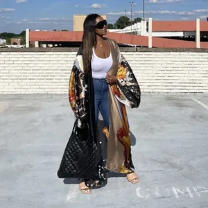 Women's casual printed long sleeve kimono cardigan in outdoor lifestyle setting.
