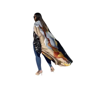 Full-length side view of a flowing long-sleeved kimono with artistic abstract print