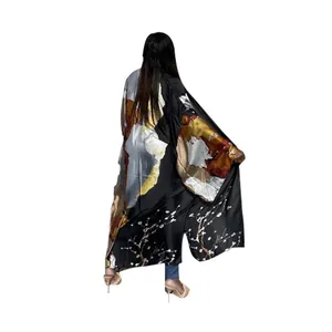 Close-up view of the back of a long loose printed kimono cardigan with floral patterns