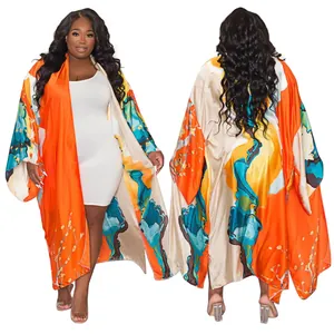 Front and back view of a women's loose casual printed kimono long sleeve cardigan
