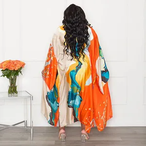 Back view of a vibrant orange and blue printed casual kimono robe in a loose fit