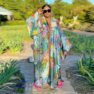 Detail view of vibrant tropical floral print on a loose casual kimono windbreaker robe