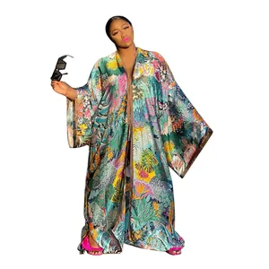 Full length view of women's vibrant floral print oversized autumn kimono cardigan