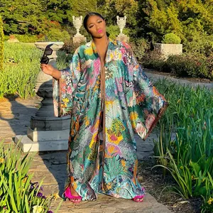 Full length bohemian tropical print kaftan kimono duster for women in a luxury garden