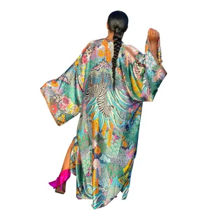 Back view of a vibrant jungle-themed long floral kimono with a zebra print pattern