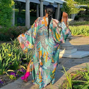 Back view of a vibrant jungle zebra print kimono cardigan with elegant side slits