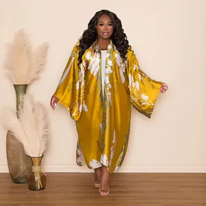 Stylish mustard yellow satin kimono with elegant white floral print and wide long sleeves