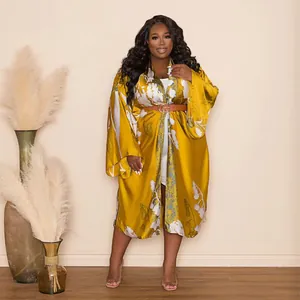 Elegant mustard yellow floral kimono duster coat with silky finish and waist belt detail.