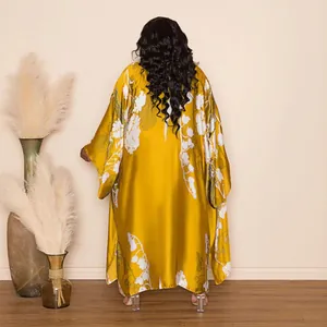 Back view of stylish yellow floral print oversized satin kimono robe with long sleeves