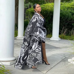 Close-up of women's long sleeve black and white abstract print kimono cardigan