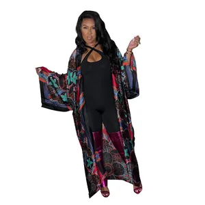 Detailed full-length view of woman wearing a colorful printed loose kimono cardigan