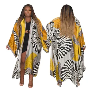 Detailed view of women's autumn zebra print long kimono cardigan with yellow accents