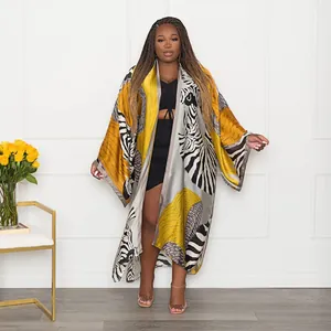 Elegant zebra and yellow print long kimono cardigan for women, loose casual style.