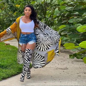 Stylish loose-fitting long-sleeved kimono cardigan with bold zebra and yellow tribal print.