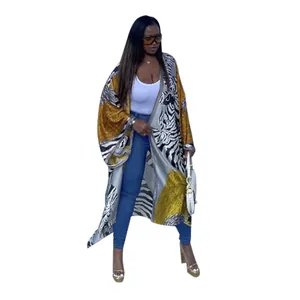 Full-length view of a women's bohemian zebra print loose kimono cardigan worn by a model