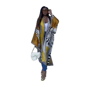 Detailed look at women's loose kimono cardigan with gold and zebra print patterns
