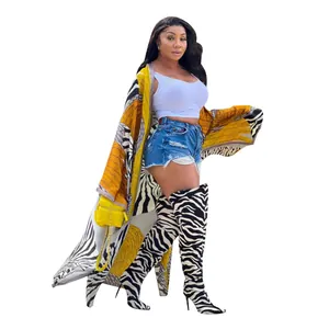 Stylish long-sleeved printed kimono cardigan featuring zebra pattern and vibrant orange