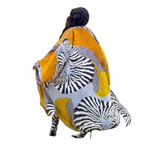 Back view of a stylish oversized zebra print long kimono cardigan with abstract patterns.