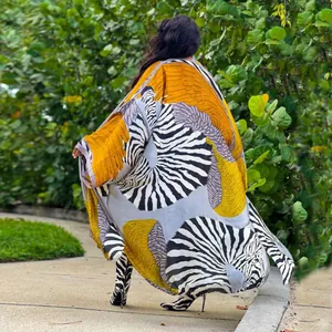 Back view of a loose autumn kimono coat featuring vibrant zebra and yellow abstract prints.
