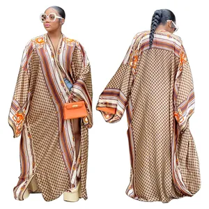 Front and back view of a loose printed long-sleeved kimono duster coat for women