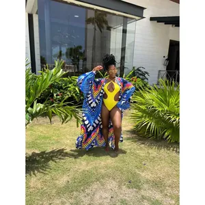 Colorful printed kimono cover-up and yellow cutout swimsuit set for beach vacation