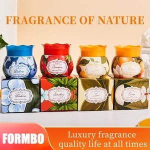 Detailed view of four FORMBO fruit-scented air freshener jars on their matching boxes